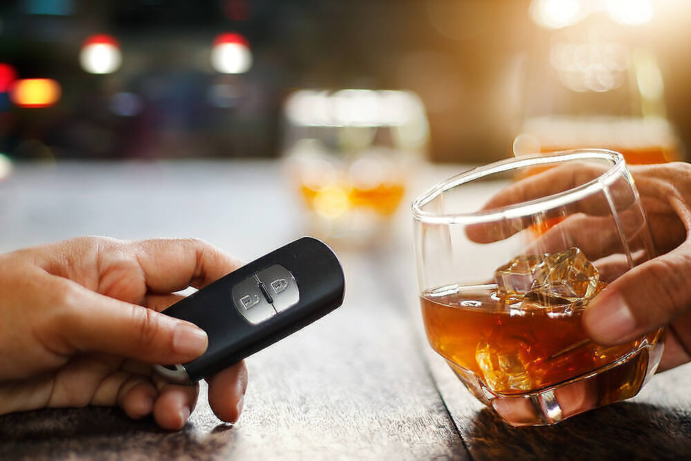 Hand holding glass of whiskey next to another hand with car key fob, illustrating risks of drunk driving|Infographic showing alcohol metabolism in the liver, from ethanol to acetaldehyde to alcohol, with facts about processing time and gender differences|Infographic explaining how food affects alcohol absorption, including its impact on the digestive system and bloodstream, with a silhouette of a person drinking|Cartoon illustration of a distressed stick figure drowning in a large wine glass filled with orange liquid and beer bottles, symbolizing alcohol addiction|Infographic showing the absorption of alcohol in the body, with a diagram of the stomach and small intestine, explaining 20% absorption through stomach walls and 80% through small intestines|Infographic showing liver metabolism of alcohol, with a diagram illustrating the conversion of ethanol to acetaldehyde and alcohol, alongside text explaining metabolism rate, food effects, and gender differences in alcohol absorption|Infographic showing silhouette of person drinking, with bullet points explaining alcohol absorption process and how eating affects alcohol consumption, debunking common misconceptions|Infographic showing symptoms of alcoholism on various body parts including brain, lungs, heart, liver, pancreas, and stomach, with a central figure drinking alcohol