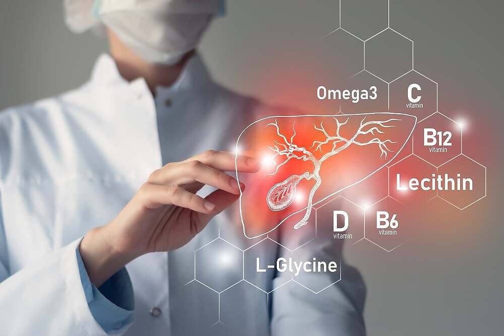 Medical professional pointing at digital illustration of liver with labeled vitamins and nutrients including Omega3, Vitamin C, B12, D, B6, Lecithin, and L-Glycine for liver repair|Person wearing a grey t-shirt with a white liver anatomy illustration, highlighting liver health awareness for alcohol recovery|Four wooden spoons displaying various vitamins and supplements, including white pills, oblong tablets, and yellow gel capsules, for liver repair after alcohol use|Image showing dried herb leaves on a small glass plate, labeled 'Bacosides', with a chemical structure diagram of the bacoside compound|White resealable pouch of Desistal dietary supplement, labeled as high strength formula with 60 capsules, featuring green logo and text|White resealable pouch of Desistal dietary supplement, featuring green logo and text, labeled as high strength formula with 60 capsules for dietary support|Front and back view of Desistal supplement packaging, showing product information and nutritional facts for liver health support