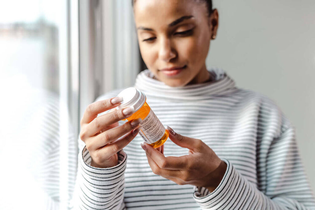 Woman in striped shirt examining orange prescription bottle, likely containing anti-craving medication for alcohol treatment|Desistal product image showing a white supplement pouch, alongside a positive Amazon review from Luke H praising its effectiveness for stopping drinking, and a green 'Buy Now' button|Desistal product image showing a white supplement pouch labeled 'High Strength Formula', alongside a 5-star Amazon review from Marta M praising its effectiveness for helping with alcohol cravings, and a green 'Buy Now' button|Image showing Desistal logo, a white supplement pouch labeled 'High Strength Formula', and a 5-star Amazon review from Marta M praising the product's effectiveness in helping with alcohol cravings|man hugging a woman in a grey top looking sad on other side image of a man and woman holding hands in the middle text saying alcohol detox at home with detox plus logo at the bottom|man hugging a woman in a grey top looking sad on other side image of a man and woman holding hands in the middle text saying alcohol detox at home with detox plus logo at the bottom|Desistal banner liver formula and anticravings forumla packets woman in a blue dress hands over glowing representation of liver